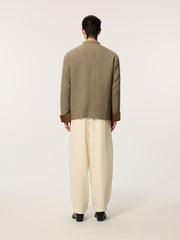 A long-sleeved, collarless coat in traditional Chinese style