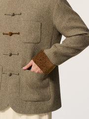 A long-sleeved, collarless coat in traditional Chinese style